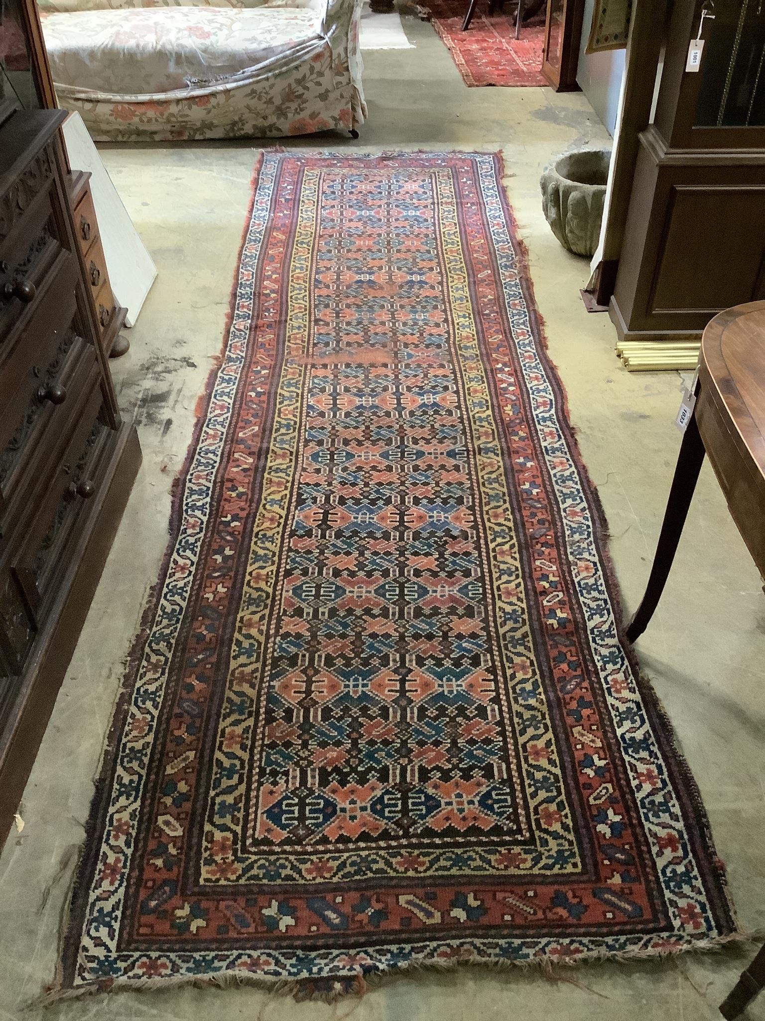 An antique Caucasian geometric runner 340 x 104cm, a machined rug and a Kelim rug